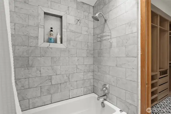 Tile-surround tub/shower and recessed niche provide both style and functionality. Tile-surround tub/shower and recessed niche provide both style and functionality.