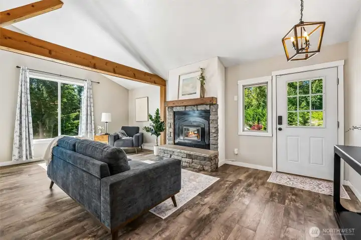 Welcomed by rustic wood beams & an open concept floor plan