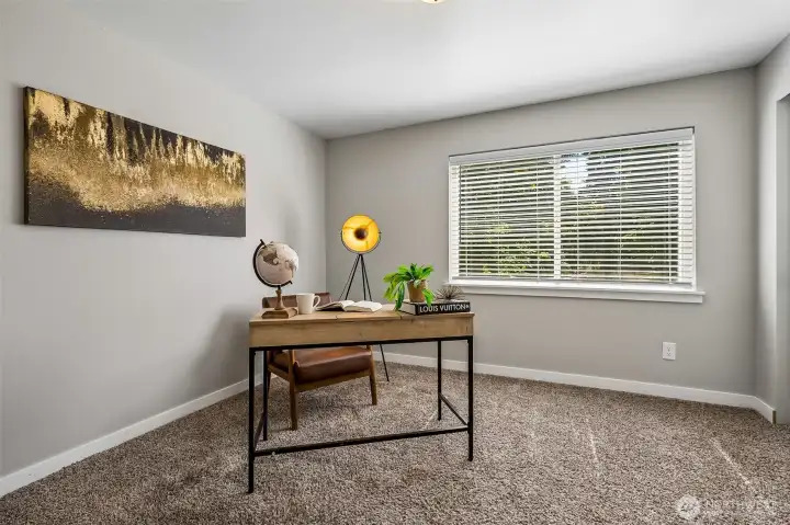 Located at the bottom of the stairs - staged as an office but this is a 3rd bedroom w/ closet