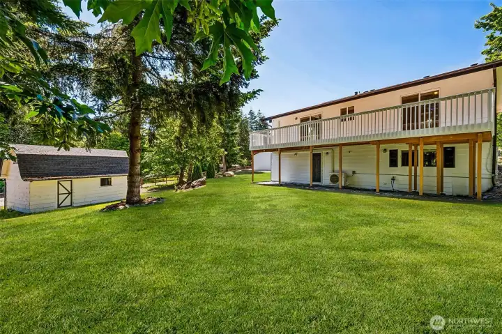 Backyard views complete w/ a mini barn + upper storage