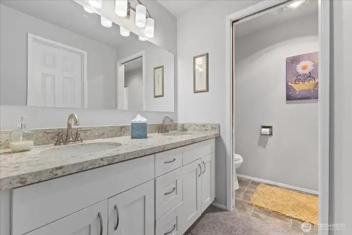 Primary bath w/ double vanity, quartz counter-tops & storage. Primary bath w/ double vanity, quartz counter-tops & storage.