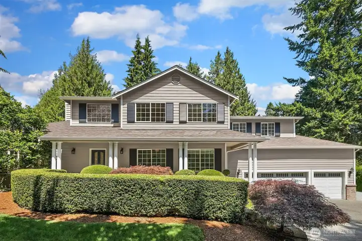 Beautiful, lush landscaping surrounds the home.