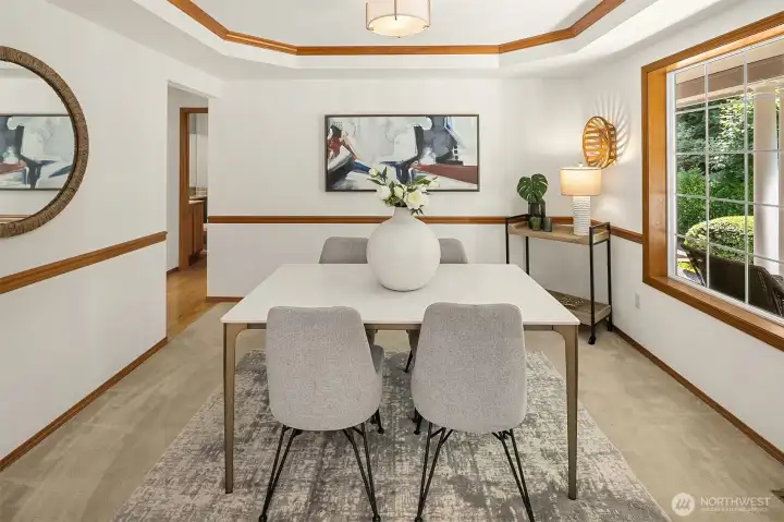 The formal dining room features a tray ceiling that adds a nice architectural detail.
