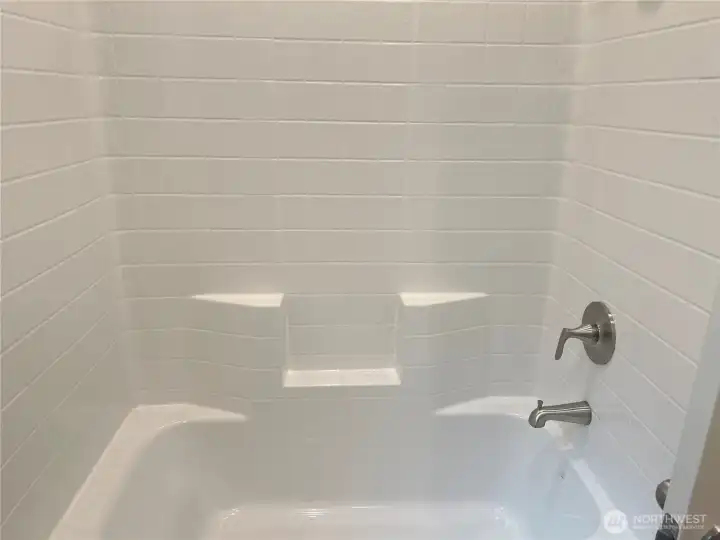 Main bathroom tub/shower. Main bathroom tub/shower.