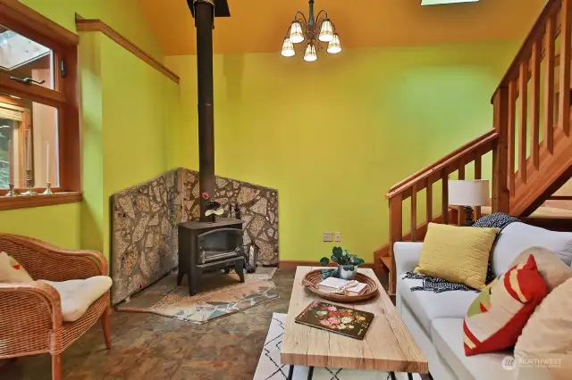 Skylights and vaulted ceilings provide spaciousness and plenty of light. Stairs to the right bring us to the loft bedroom above.