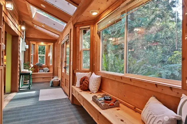 Sweet window seat to the right with a huge window. Straight ahead is another window seat, perfect spot for a table for two. The propane stove is to your back.