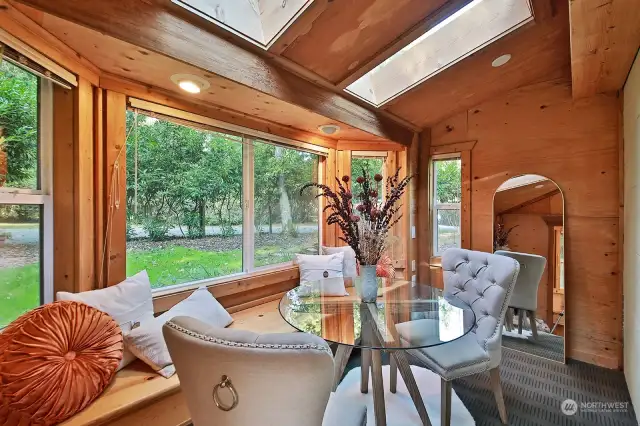 You have just turned the corner, propane stove is to your left just outside this photo. Versatile space. Previous owners had a bed here and this served as a guest bedroom. Could be an office or second sitting area. Skylights!