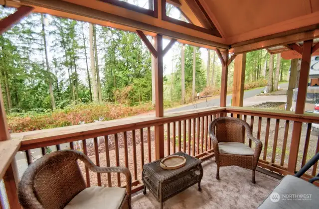 FRONT PORCH OF THE CABIN WITH VIEW OF THE FOREST AND BEAUTIFUL SUNSETS