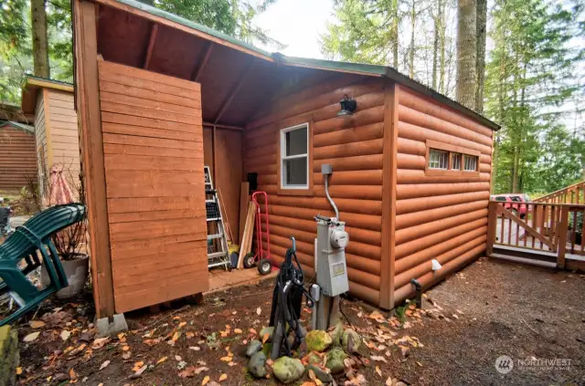 BACK OF THE SHED THAT HAS WASHER DRYER