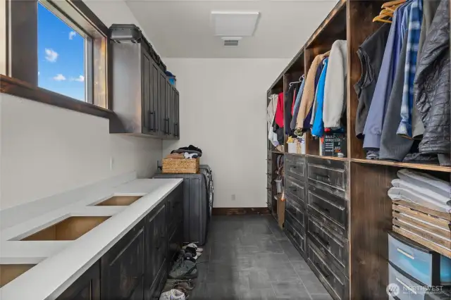 Walk in closet with laundry off the primary.