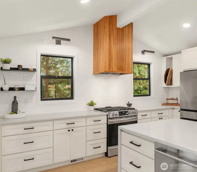 Updated, bright kitchen with oversized island for entertaining or eating.