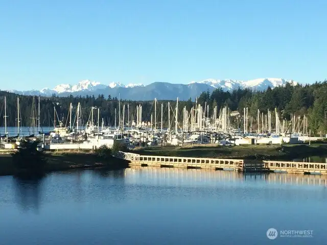 The majestic Olympic Mountains rise over the Port Ludlow Marina and Bay. The marina is welcome to the public.