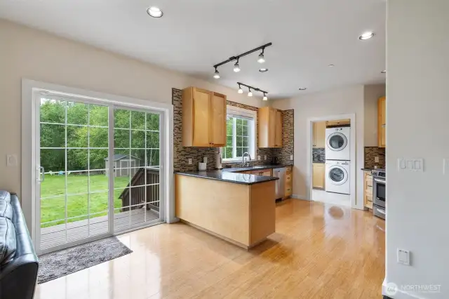 Eating area to kitchen with slider to back deck area