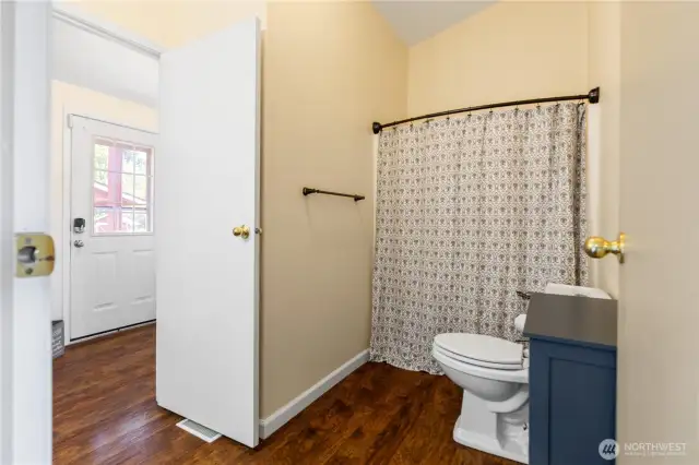 Full bath off living and utility room