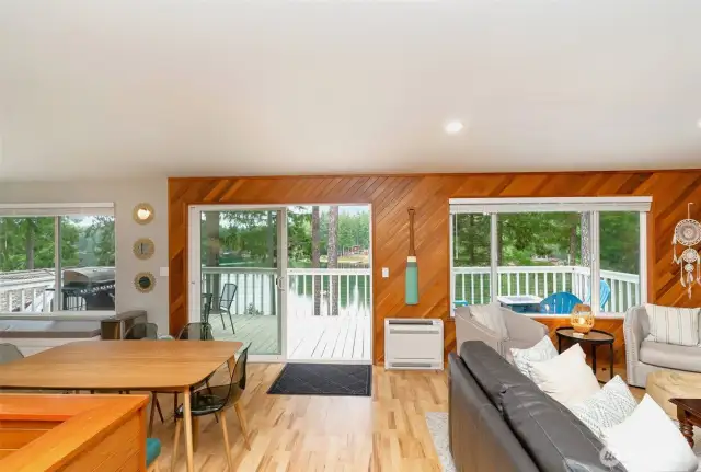 Walls of windows and oversized slider to the deck