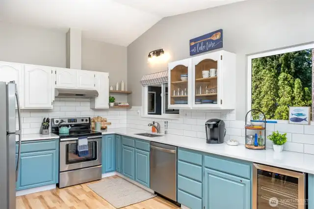 Kitchen with stainless appliances, quartz, subway tile