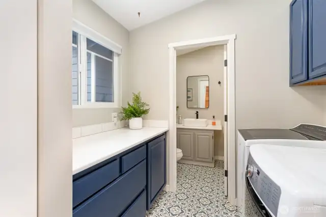 Main floor laundry room with full bathroom