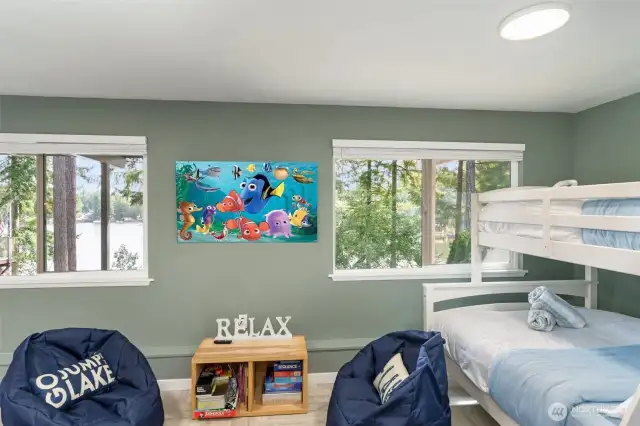 Bonus room downstairs with a wall of windows