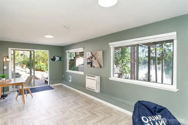 Other end of bonus room with slider to the hot tub and backyard