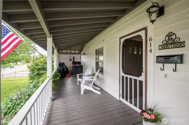 See the charm of the early 1900 farm houses in this full front porch.
