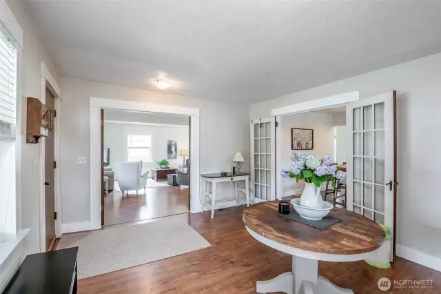 Enter the kitchen and living room through two sets of french doors.