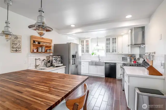 Like the rest of this home, the remodeled gourmet kitchen provides ample space for meal prep work or baking and has a large eating area.