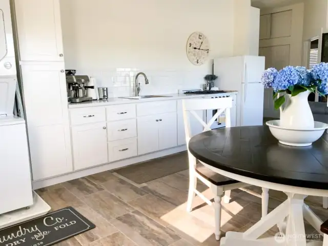 The rest of the second floor features this ADU currently being used as an Air BnB! Complete with kitchen and bath. Furniture stays with home!