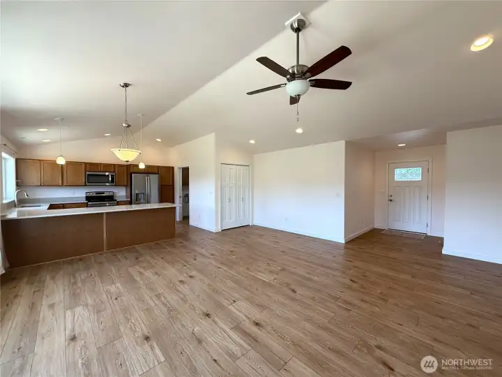 Custom cabinetry with ceiling fan in open concept living area.