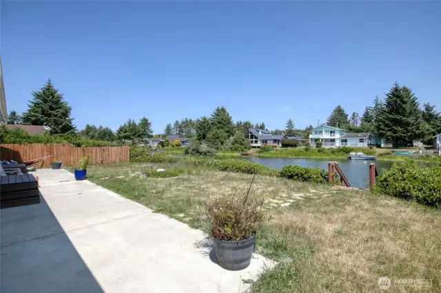 Spacious concrete slab off backyard for entertaining.