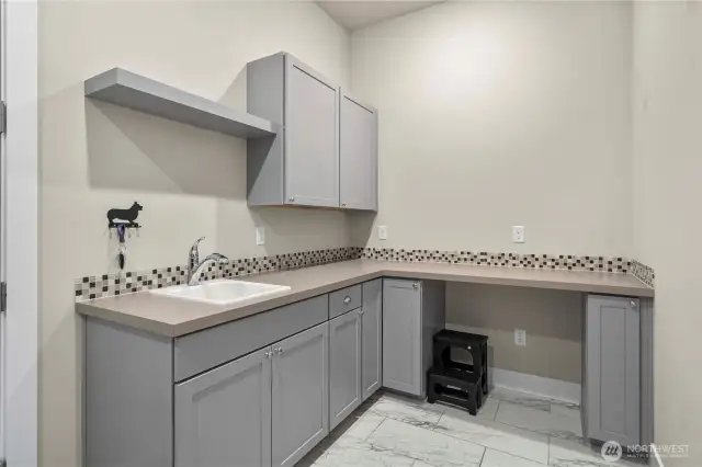 The Smart Space is conveniently located as you enter from the (fully finished) garage and offers a handy utility sink, great counterspace and lots of storage.