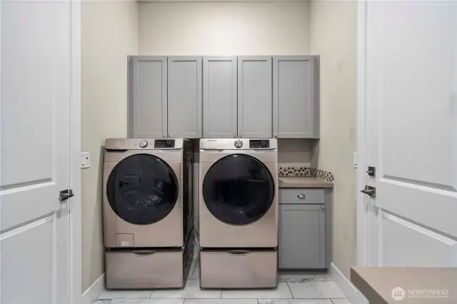 Washer and dryer on pedestals and even more storage.