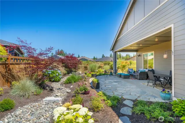 Beautiful yet low-maintenance back yard has been thoughtfully designed to delight year-round.