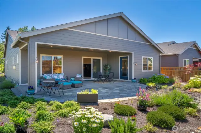 The oversized covered patio spills out to the huge Flagstone patio.  Yard is fully irrigated and low maintenance.