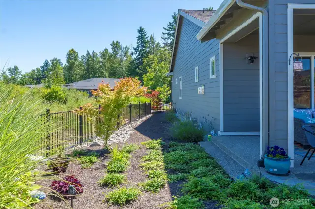 The permanent berm offers so much privacy and beautiful vistas!  Yard is fully fenced.