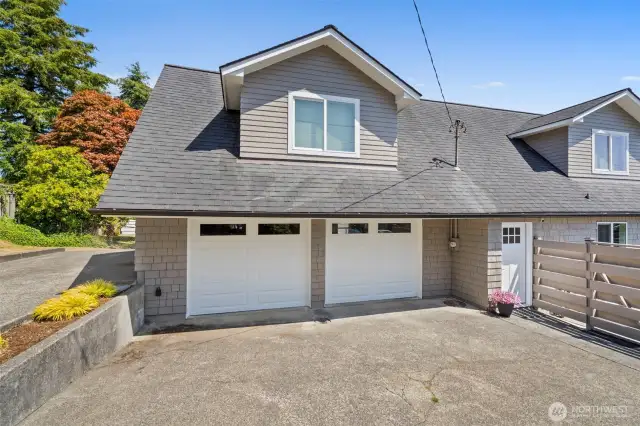 Access to the back door and deck from the driveway.