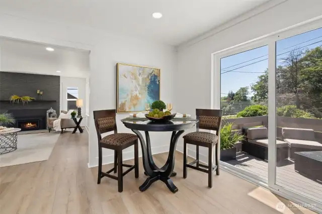 Dining area off the kitchen with brand new slider doors that open onto the new deck.
