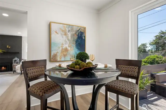 Dining area off the kitchen with brand new slider doors that open onto the new deck.