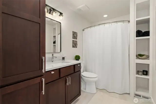 Large full bathroom in the hallway between the two bedrooms. Newer upgrades plus new paint and lighting. Tons of storage space!