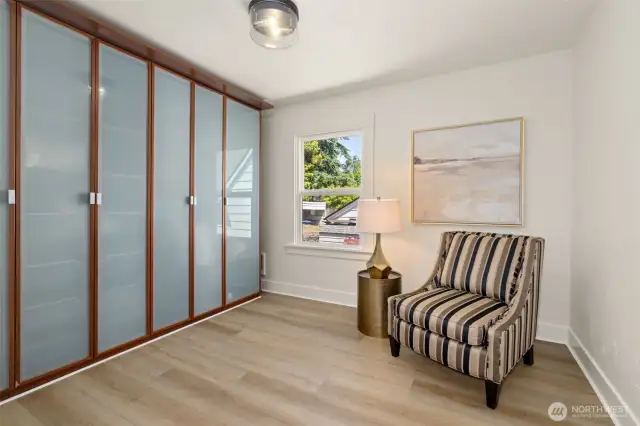 Bedroom #2 at the back of the home. The wall of closets can stay or go with new owners. Another large closet in this bedroom not pictured. This bedroom can easily fit a queen sized bed and furniture.