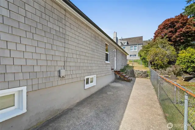 This is the fully-fenced area off the garage to the right of the home - perfect for your pets or room for kids to play. Gate entry from the RV parking area.