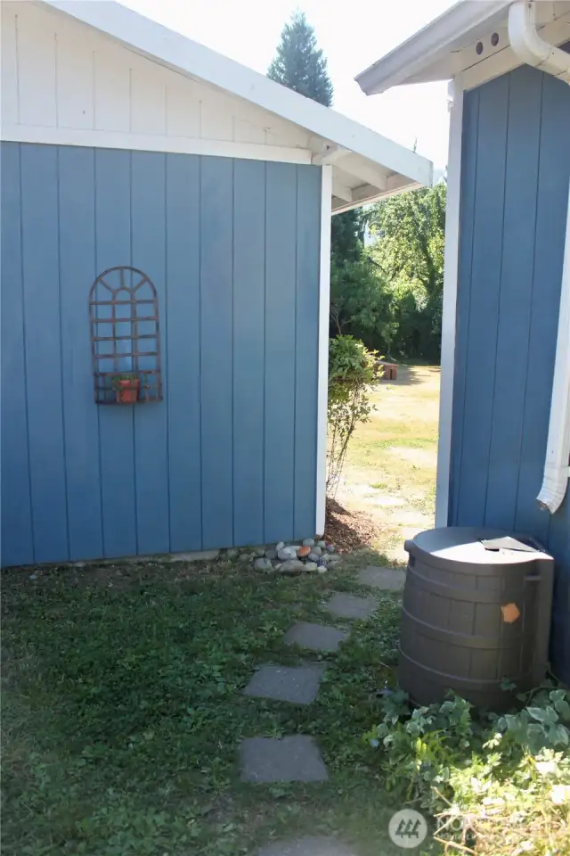 Into the backyard between the house and garage