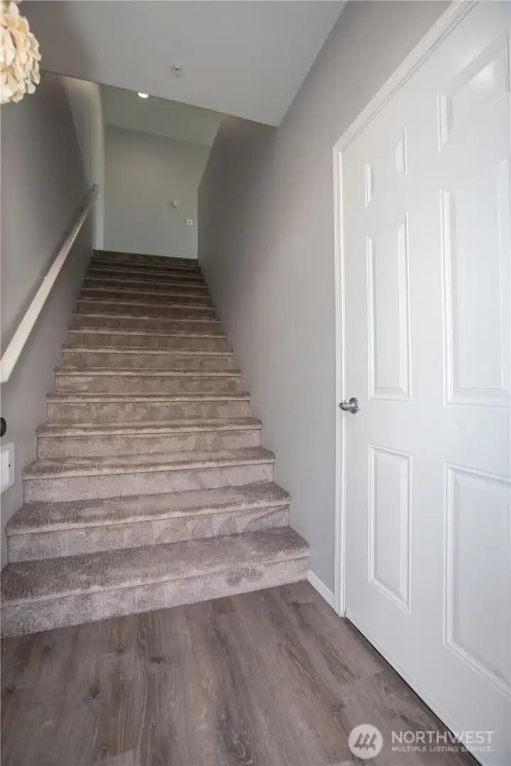 staircase up to the living area and garage access door