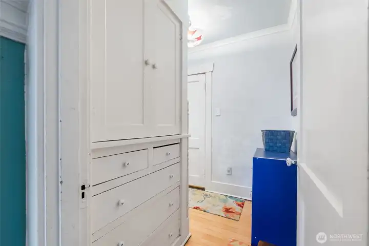 Connected to the Dining room, a hallway leads to the main floor bathroom, bedroom and stairs to the second floor