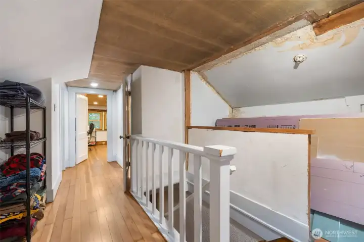 Upstairs leads to two more bedrooms, and a roughed-in bathroom!