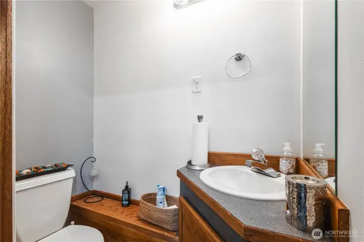 Half bath in garage near salon/utility space!