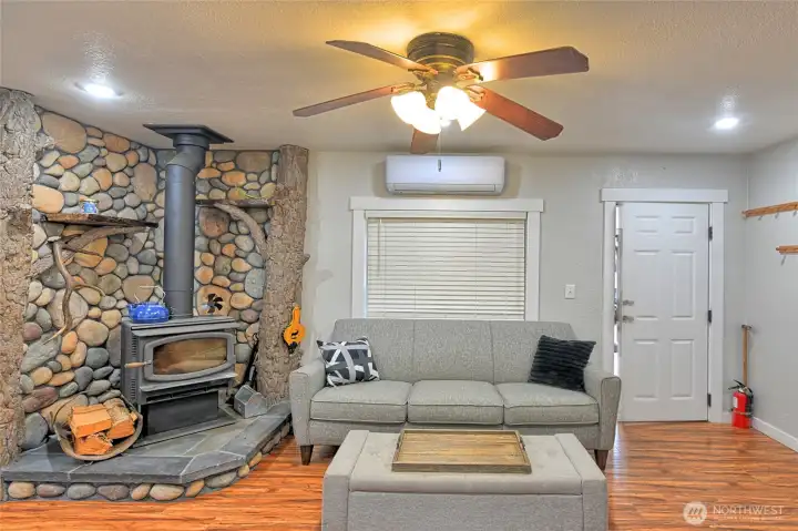 River rock fireplace.  Above window is the Mini split system for additional heat/AC