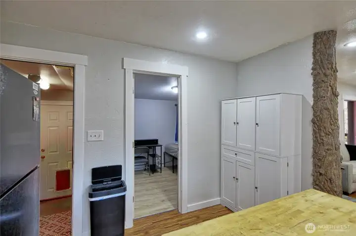 view from Kitchen into bonus/flex room on right Laundry on left