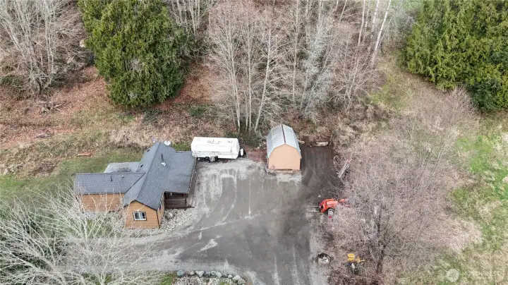 View from above showing the Home,  RV pad & Barn