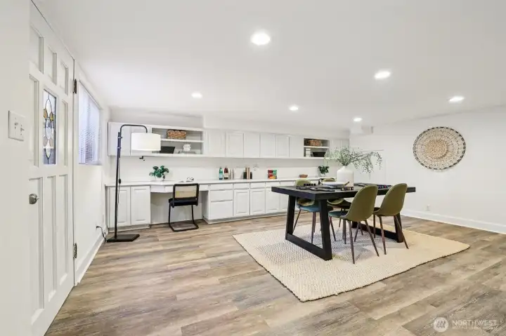 Lower level w/separate entry includes large family room  with built-ins—great MIL or Airbnb potential.