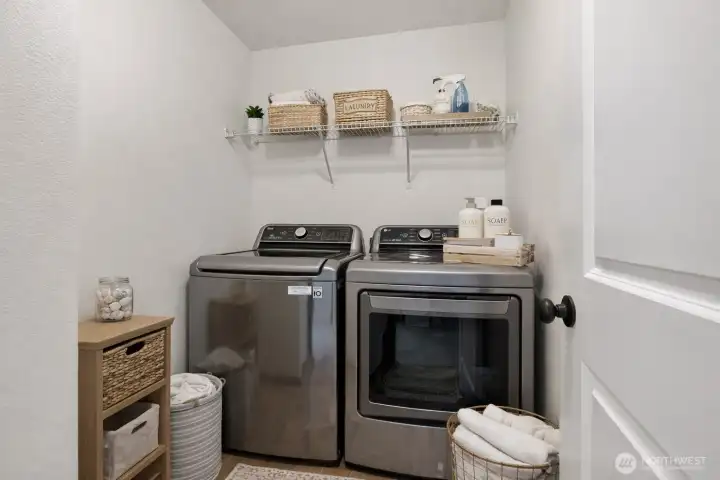 Virtually staged laundry room - washer and dryer stay